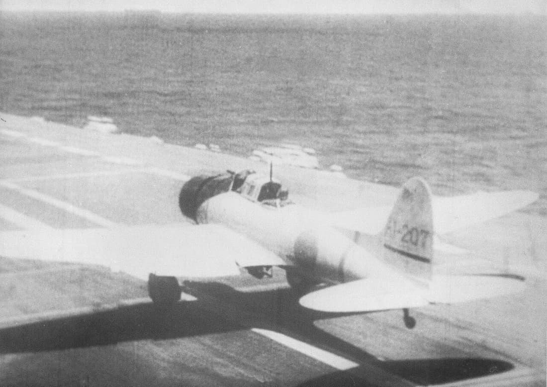 An Aichi D3A Type 99 dive bomber takes off from the Imperial Japanese Navy aircraft carrier Akagi to attack British warships during the Indian Ocean Raid on 5 April 1942. The aircraft belongs to a section leader (shōtaic