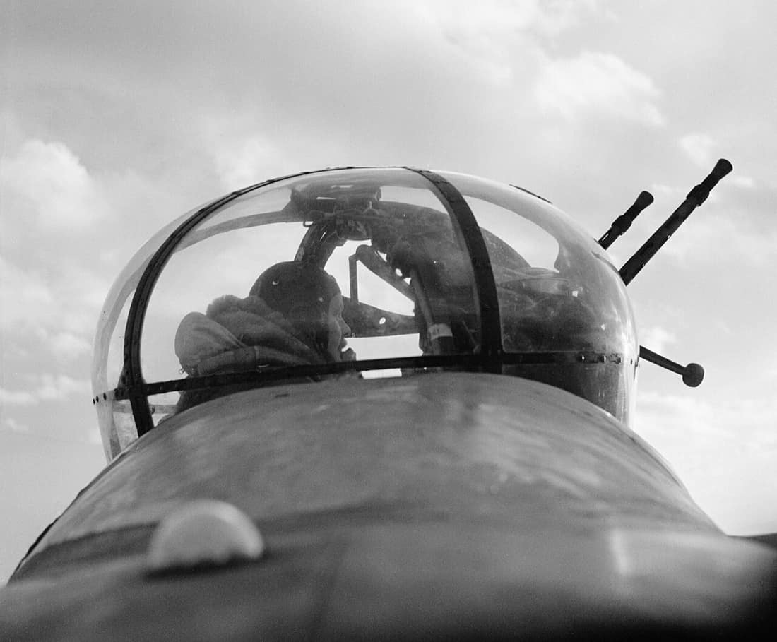A No. 57 Squadron Lancaster mid-upper gunner in his turret, February 1943. A No 57 Squadron mid-upper gunner, Sergeant 'Dusty' Miller, 'scans the sky for enemy aircraft' from a Lancaster's Fraser Nash FN50 turret. This i