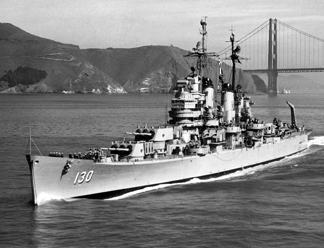 The U.S. Navy heavy cruiser USS Bremerton (CA-130) passing under the Golden Gate Bridge, California (USA), in April 1955.