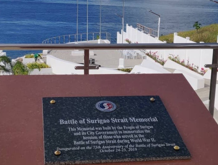 The Battle of Surigao Strait Plaque is installed on a pedestal overlooking the memorial.