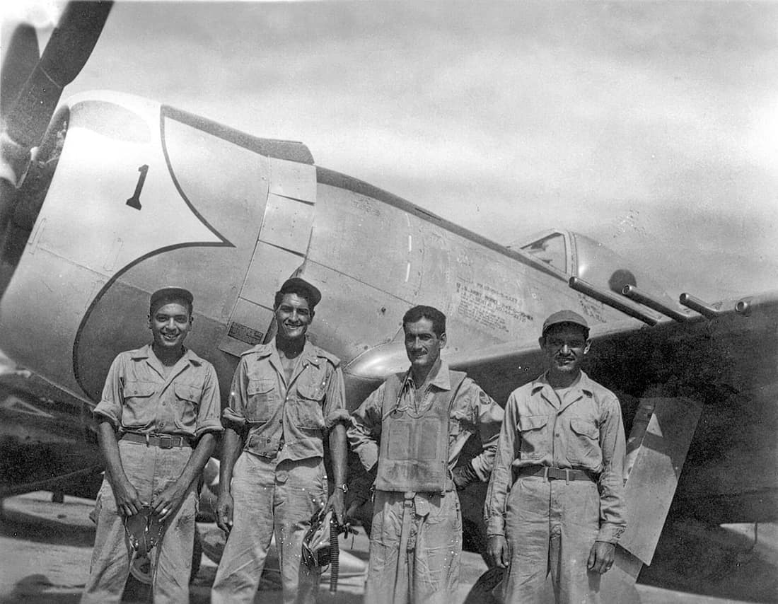 Mexican air force Capt. Radames Gaxiola Andrade stands in front of his P-47D with his maintenance team after he returned from a combat mission. Captain Andrade was assigned to the Mexican air force's Escuadron 201. Membe