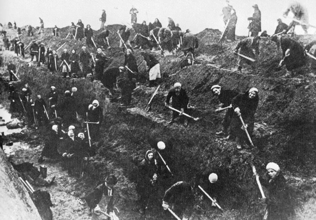 Armed with heavy shovels, a hastily assembled work force of Moscow women and elderly men gouge a huge tank trap out of the earth to halt German Panzers advancing on the Russian capital. In the feverish effort to save the