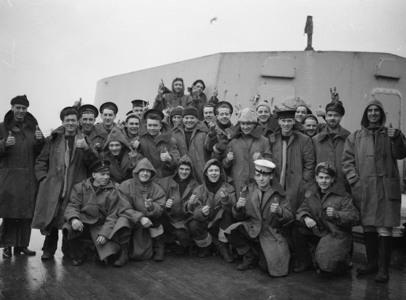 A Warship Which Took Part in the Action Off the North Cape on 31 December 1942. HMS Sheffield, at Greenock, 10 January 1943. Some of the gun's crew of the HMS SHEFFIELD which took part in the battle off the North Cape, 3