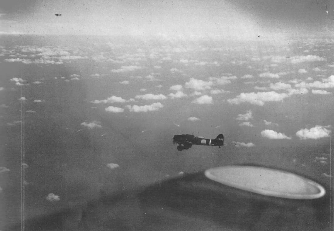 Aichi D3A Type 99 Kanbaku dive bombers on their way to attack United States Navy ships on May 7, 1942 during the Battle of the Coral Sea. The bomber seen across the wing is from Imperial Japanese Navy aircraft carrier Sh