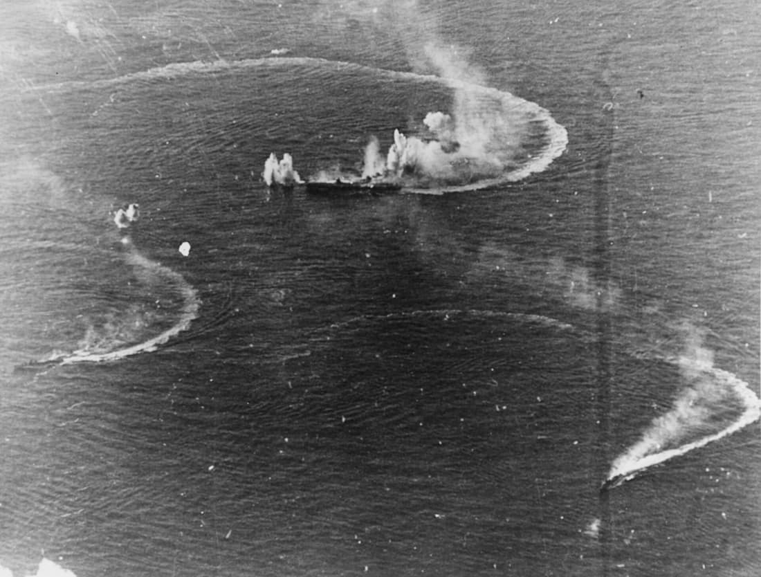 Battle of the Philippine Sea: the Japanese aircraft carrier Zuikaku (center) and the destroyers Akizuki and Wakatsuki maneuvering, while under attack by U.S. Navy carrier aircraft, during the late afternoon of 20 June 19