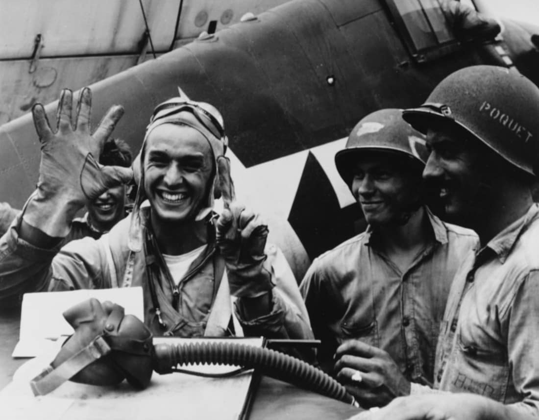 Battle of The Philippine Sea, June 1944 (Catalog #: 80-G-23684): Lieutenant Junior Grade Alexander Vraciu, USNR; fighting squadron 16 "Ace", holds up six fingers to signify his "kills" during the "Great Marianas Turkey S