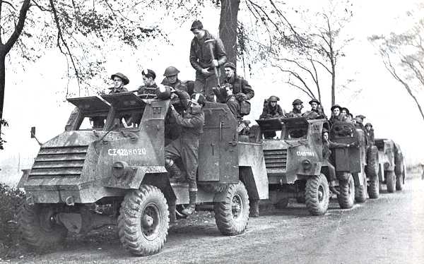 Forces of the Royal Hamilton Light Infantry, part of the 2nd Canadian Infantry Division, move towards South Beveland during the Battle of the Scheldt