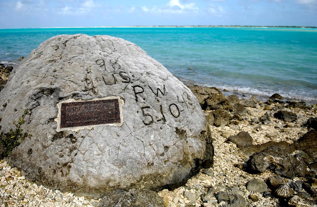 The "98 Rock" is a memorial for the 98 U.S. civilian contract POWs who were forced by their Japanese captors to rebuild the airstrip as slave labor, then were blind-folded and killed by machine gun Oct. 5, 1943. An unide