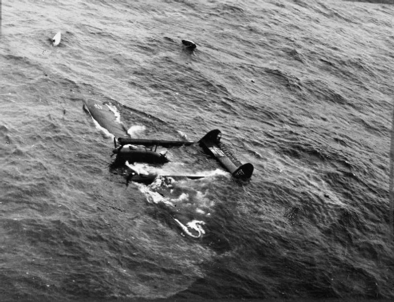 A German Blohm &amp; Voss Bv 138 flying boat settles in the water after being shot down by a Bristol Beaufighter of No. 404 Squadron RCAF while escorting a Naval force off the north coast of Scotland.