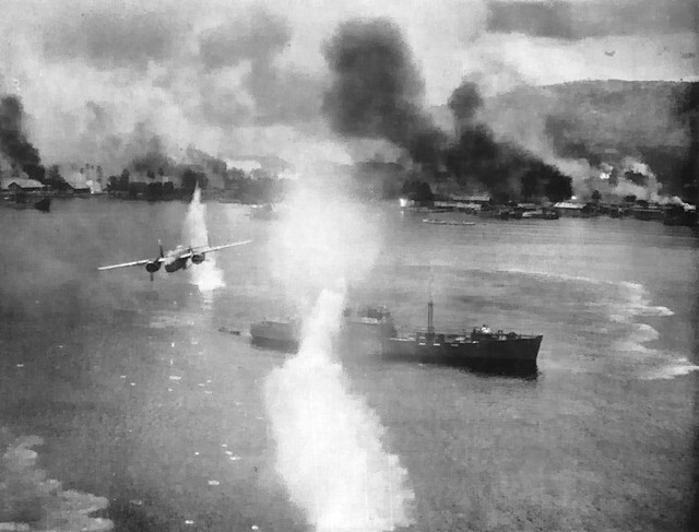Air-raid by 71st Bomb Squadron of the 38th Bomb Group at Simpson Harbor, Rabaul. B-25 bomber is piloted by Richard Hastings, picture taken from another B-25 piloted by Frank Cecil (Bruce Gamble: Target: Rabaul, b&amp;w p