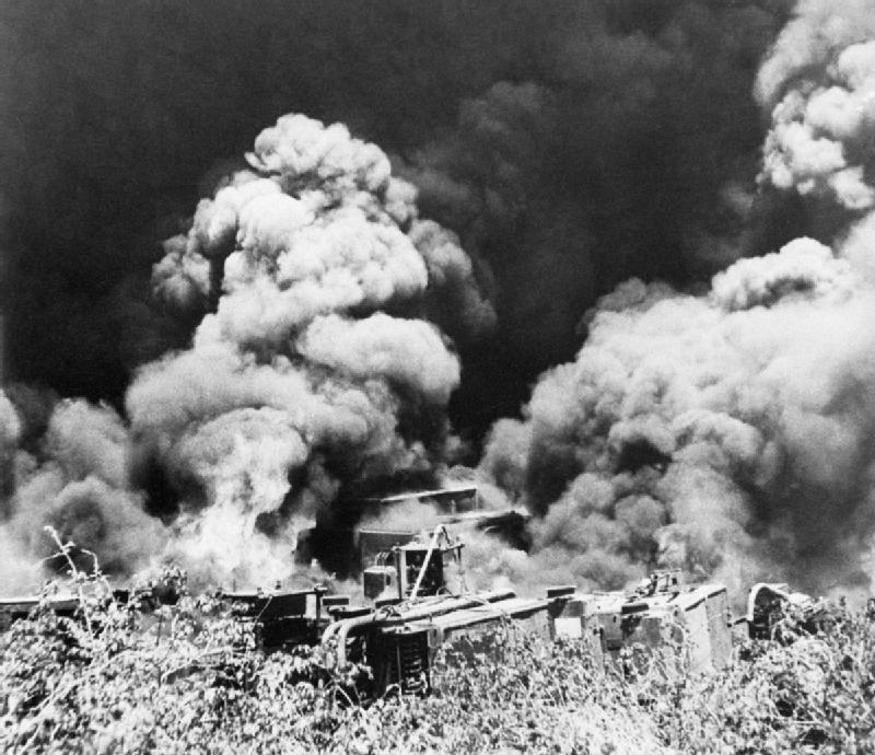 British troops destroy equipment and machinery at the Yenangyaung oilfields in Burma before retreating, 16 April 1942. The Retreat into India: British troops destroy equipment and machinery at the Yenangyaung oilfields b