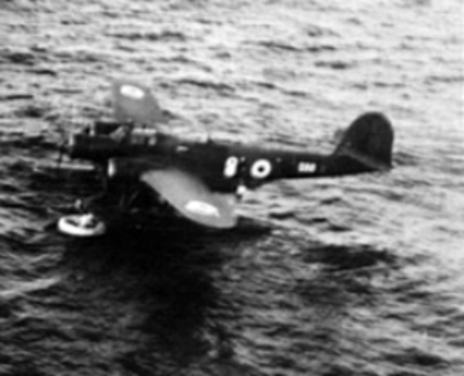 RAAF Squadron Leader P.A.S. Payne and Flight Sergeant E.M. Potts climb aboard the Italian CANT Z.506 Airone float plane which rescued them after they had been forced to ditch their Beaufighter aircraft following engine t