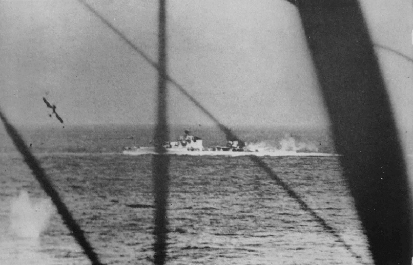 The Italian heavy cruiser Bolzano under attack by Swordfish of the Fleet Air Arm on 28th March 1941. The photograph taken from the second aircraft shows the splash of a torpedo entering the water.