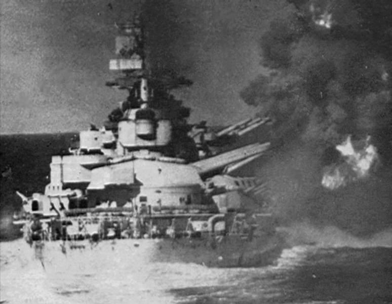 The Italian Battleship Vittorio Veneto firing her 15in guns on British cruisers during a brief engagement near Gaudo Island, the afternoon before the battle of Matapan.