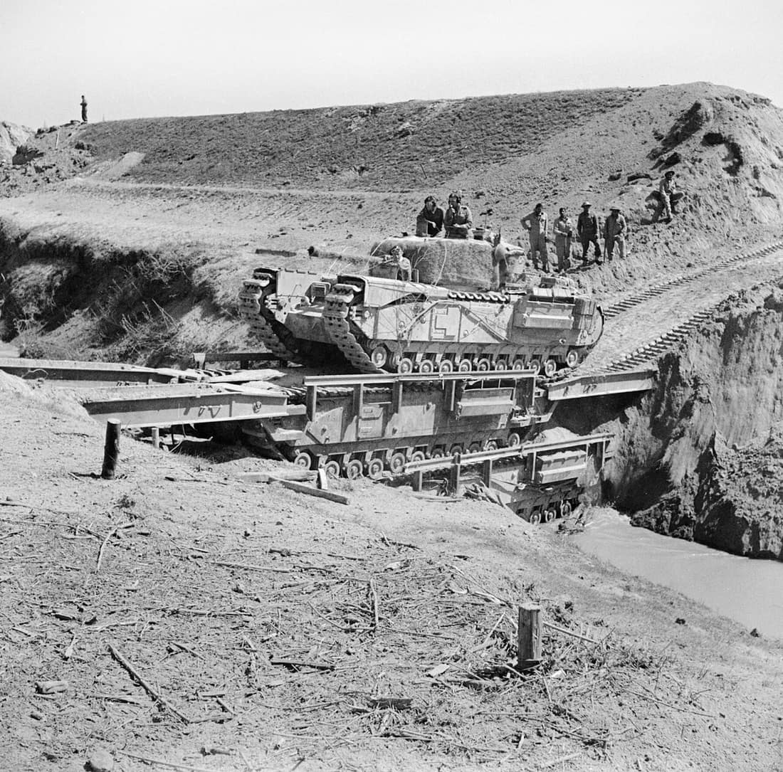 IWM caption : A Churchill tank of the North Irish Horse crossing the River Senio in Italy over two Churchill Ark bridging tanks.