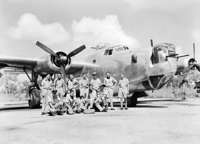 AWM caption : Fenton, NT. 1945-03. An informal group portrait of a crew of a Consolidated B-24 Liberator bomber aircraft of No. 21 Squadron RAAF, standing beside their aircraft. Left to right: Back row: Flight Sergeant (