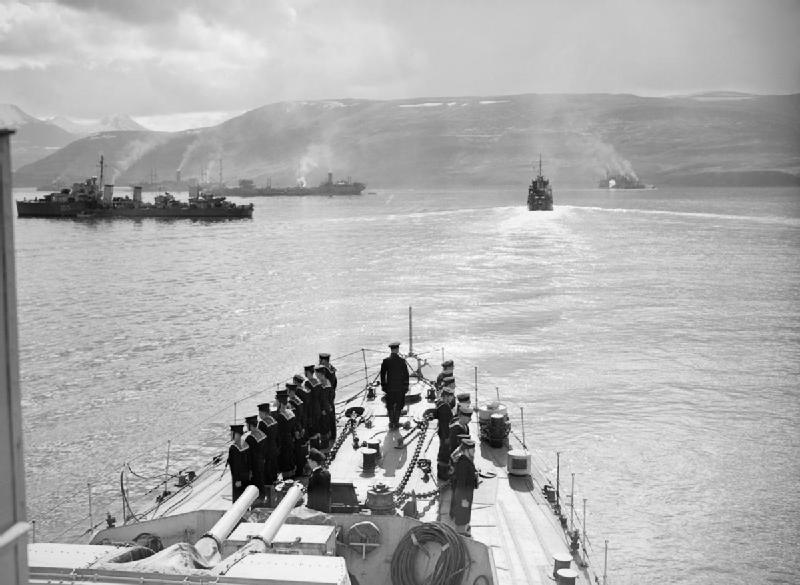 Escorts and merchant ships at Hvalfjord before the sailing of Convoy PQ-17. Behind the destroyer Icarus (1.03) is the Russian tanker AZERBAIJAN. The sea voyage to the north Russian ports of Murmansk and Archangel was the