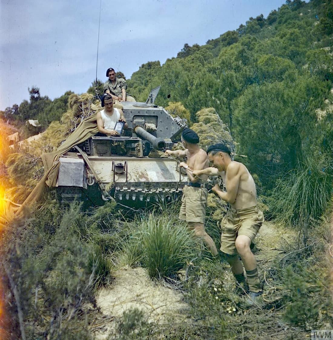 IWM caption : "THE BRITISH ARMY IN NORTH AFRICA, 1943: THE DRIVE ON TUNIS. Sergeant Elms of 16/5 Lancers and his tank crew at El Aroussa; Trooper Bates, Royal Armoured Corps, Signalman Bower, Royal Corps of Signals, and 