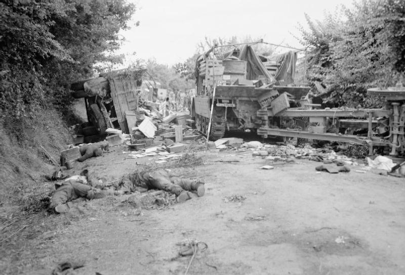 Royal Air Force- 2nd Tactical Air Force, 1943-1945. A road near Chambois, south-east of Trun, Normandy, filled with wrecked vehicles and the bodies of retreating German soldiers following an attack by Hawker Typhoons of 