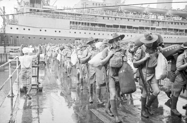 Singapore, Malaya, 15 August 1941. Members of 'C' Company, 2/30th Battalion disembark from Johan Van Oldenbarnevelt (HMT FF), part of Convoy US11B. First row - nearest to camera: 1) NX41357 - CAMERON, Alan Rentoul, Lt. -