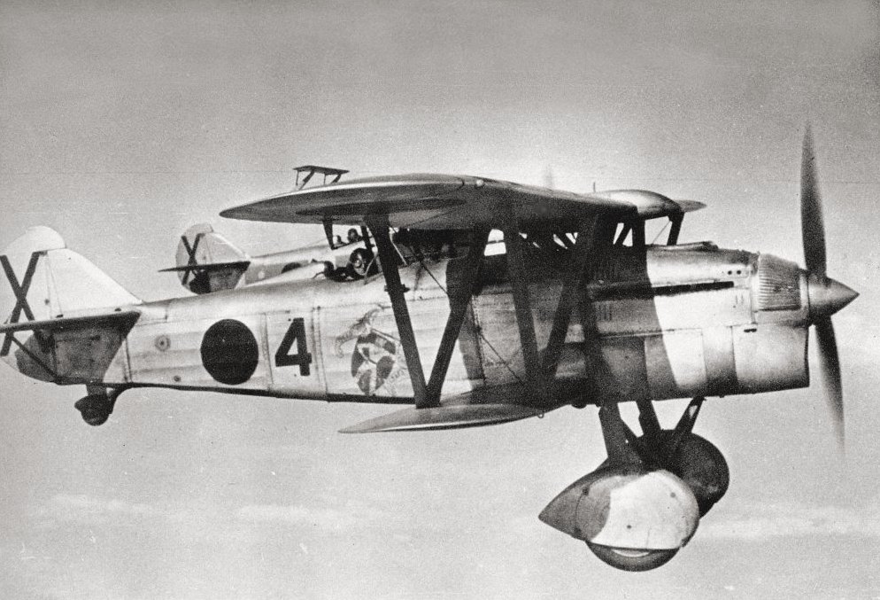 A pair of Fiat C.R.32 of the X Gruppo "Baleari". The foreground aircraft is flown by D'Agostini