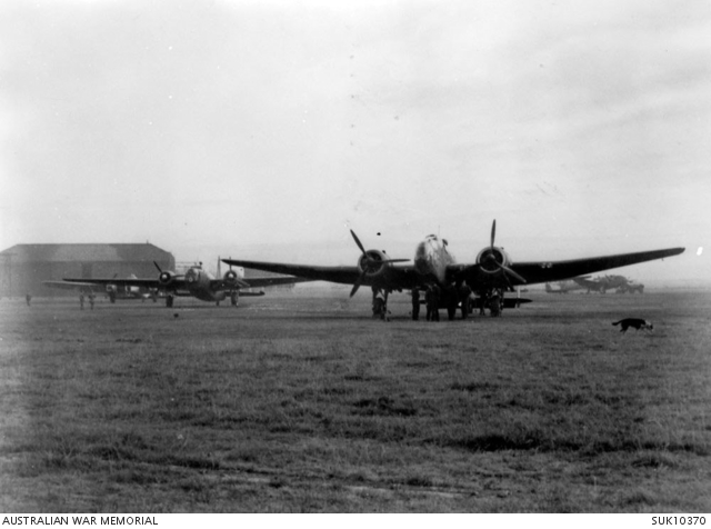 AWM caption : ENGLAND. C. 1942. A HAMPDEN AIRCRAFT OF NO. 455 SQUADRON RAAF AT RAF STATION WIGSLEY STANDING IN FRONT OF A WELLINGTON BOMBER AT A BOMBER COMMAND BASE EARLY IN 1942. PORTION OF A WHITLEY BOMBER AIRCRAFT MAY