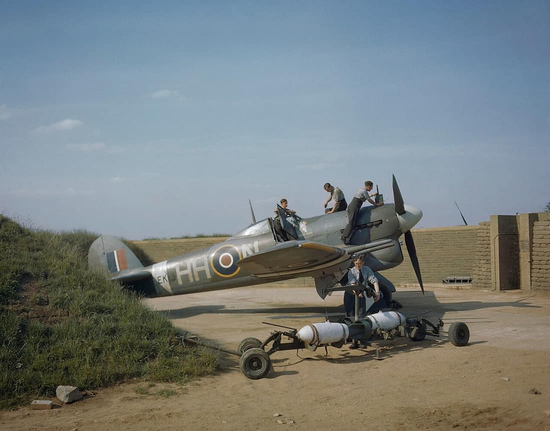 The Royal Air Force in Britain, May 1943 Hawker Typhoon Mk.IB, EK139 'HH-N' 'Dirty Dora', of No. 175 Squadron RAF, undergoing servicing in a blast-walled dispersal revetment at RAF Colerne in Wiltshire, England. Two dumm