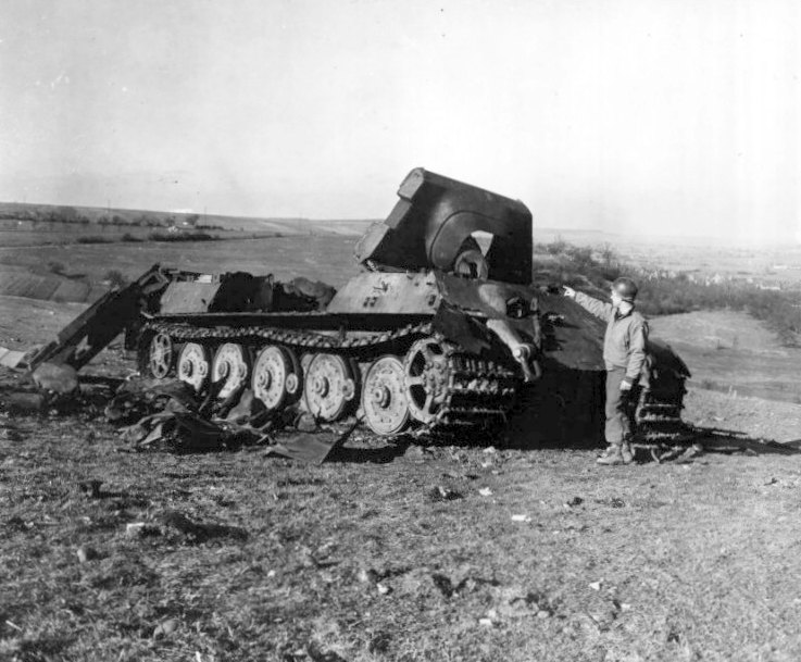 A destroyed German Jagdtiger tank of Schwere Panzerjäger-Abteilung 653 near Rimling, Lorraine (France), 28 February 1945. Original Caption: "A Jadgtiger tank, a type previously reported on the Russina front, is examined 