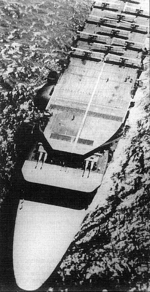 Forward overhead view of the Imperial Japanese Navy aircraft carrier Akagi soon after two twin 8-inch turrets were installed on the carrier's middle flight deck in 1929.