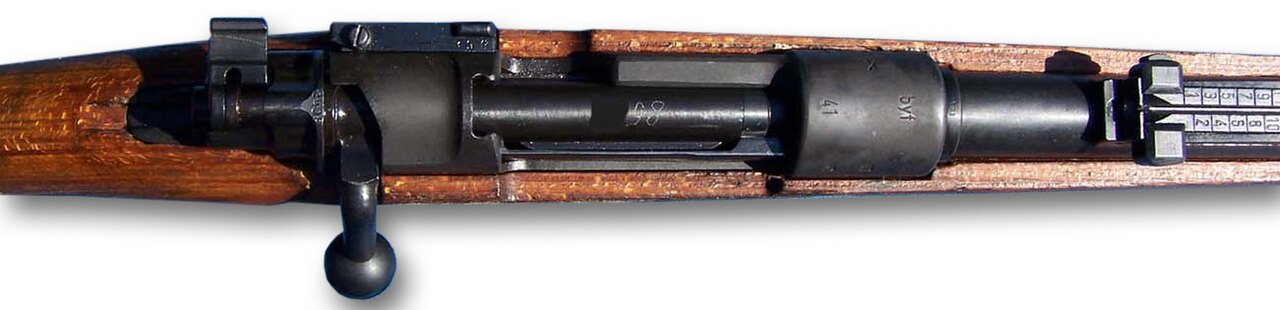A close up of the action of a Karabiner 98k. Note the electro-penciled bolt and the X on the left side of the receiver. Both are indicators of a Russian captured weapon.