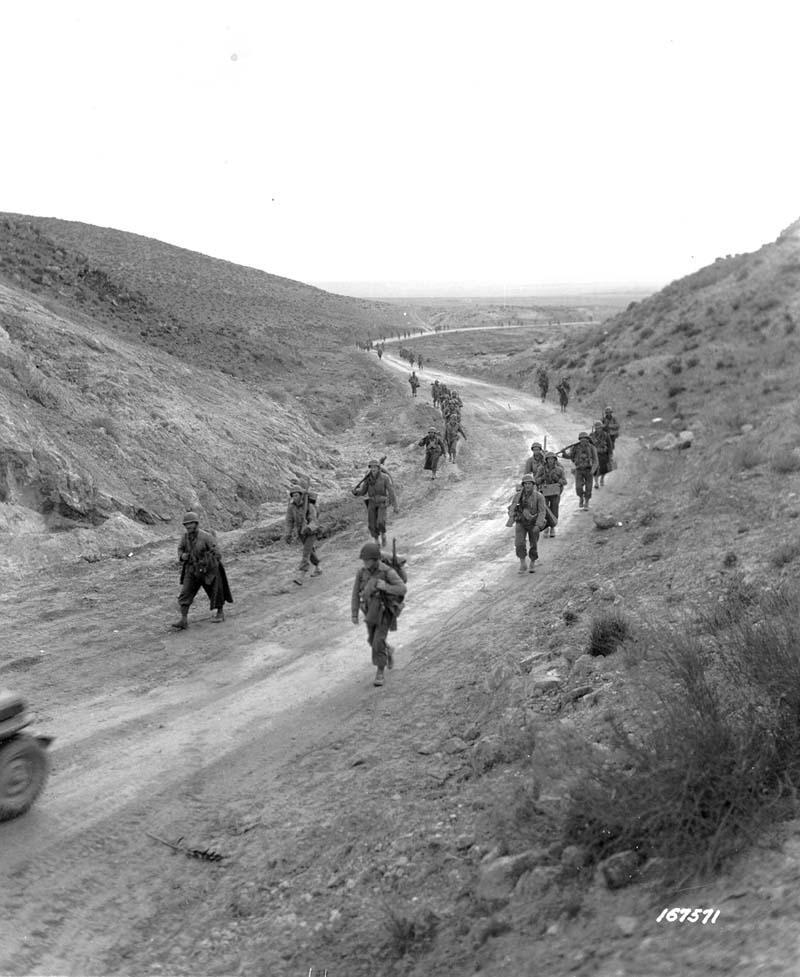English: Photo: SC 167571 - 2nd Battalion, 16th Infantry clearing the road and clearing mines, walking through the Kasserine Pass, Tunisia .26 Feb 1943.Photographer: McGray.