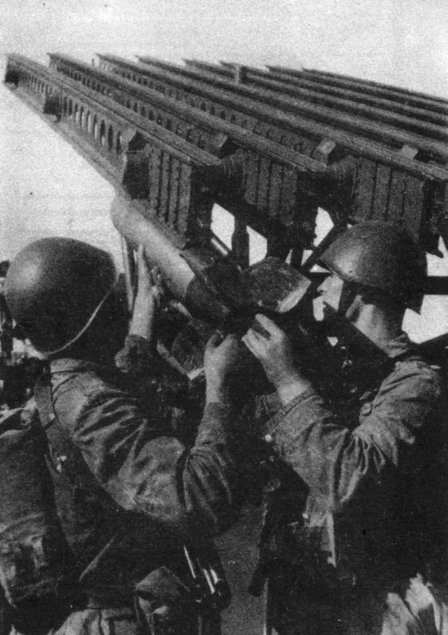 Polish Army soldiers loading rockets onto a BM-13 (post-WWII).