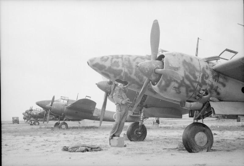 A Royal Air Force officer examining a Japanese Kawasaki Ki-45 Toryu fighter/ground attack aircraft (known to the Allies as a "Nick"). This was one of a number of aircraft abandoned at Kallang Airport, Singapore.