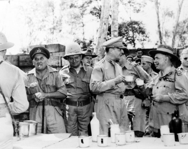 New Guinea. October 1942. A tea break at a canteen in the forward areas during a tour of inspection by US General (Gen) Douglas MacArthur. In the background, left to right, are: Major General G. S. Allen, Commander, Aust