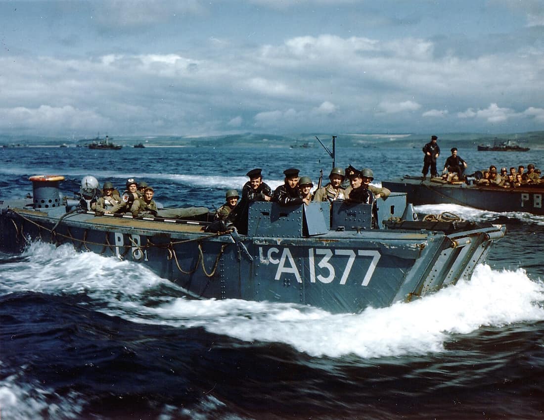 http://www.history.navy.mil/photos/images/ac00001/ac01087c.htm Photo #: USA C-1087 (Color) British Navy Landing Craft LCA-1377 Carries American troops to a ship, in a British port during preparations for the Normandy inv