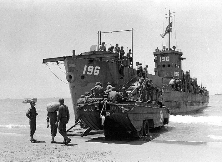 Sicily Invasion, July 1943. Soldiers loading bags and other items from a DUKW to USS LCI(L)-196, in the Scoglitti area. USS LCI(L)-196 (1943-1947), later LCI(G)-196 USS LCI(L)-196, a 246-ton landing craft, infantry, was 