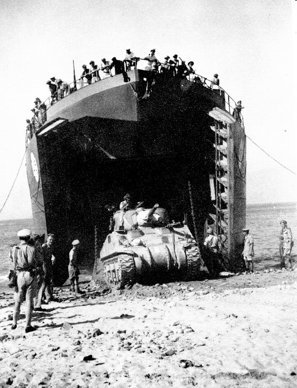 Canadian LST offloading a Sherman Tank on the beach during the Allied invasion of Sicily in 1943.