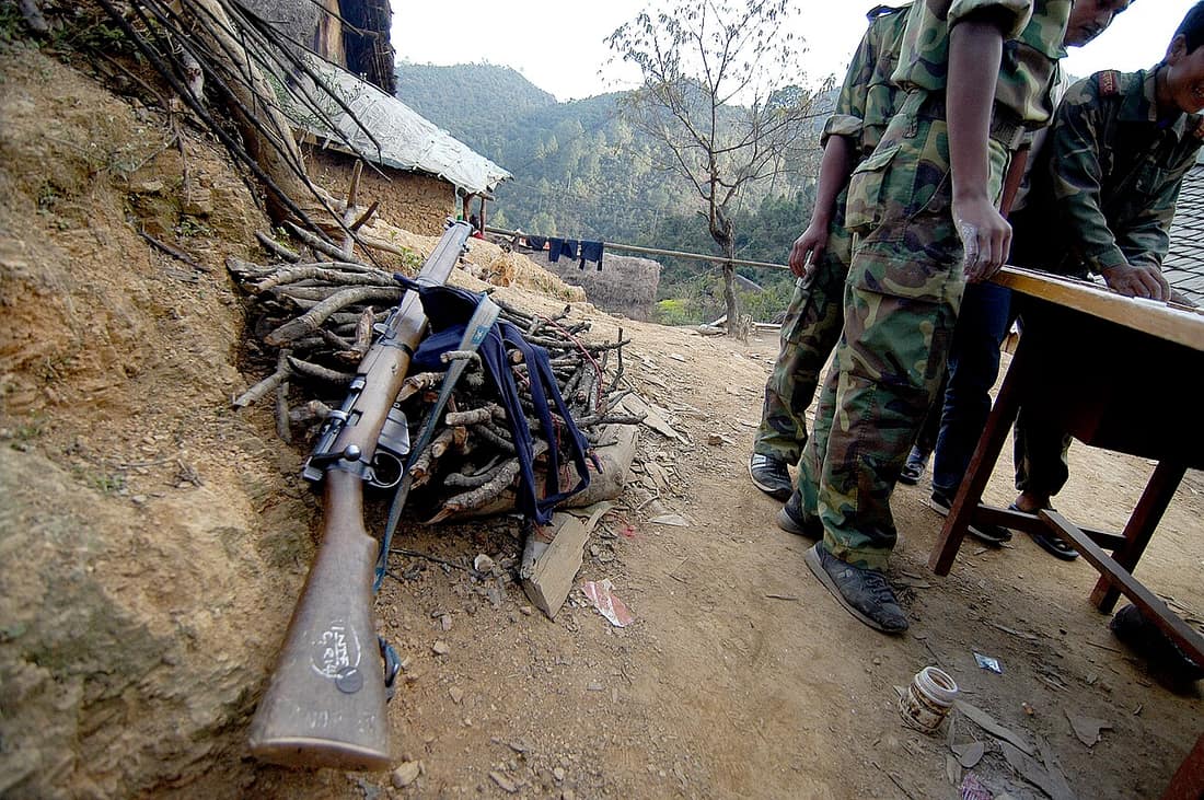 A WWII British Lee Enfield .303" rifle is left unattended near a group of Maoist rebels in the Rolpa district (Nepal), during a ceasefire