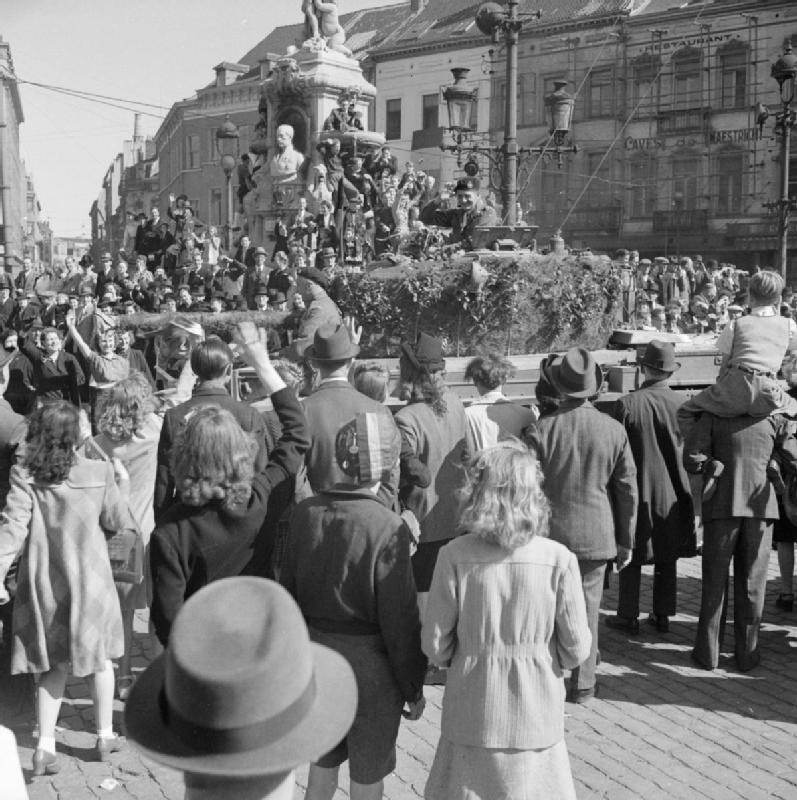 Scenes of jubilation as British troops liberate Brussels, 4 September 1944. Major General A H S Adair, GOC Guards Armoured Division, acknowledges the crowd from his Cromwell command tank.