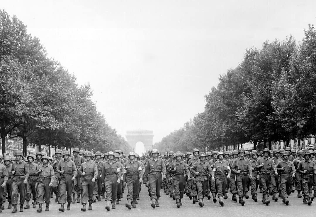 American troops of the 28th Infantry Division march down the Avenue des Champs-Élysées, Paris, in the `Victory' Parade.