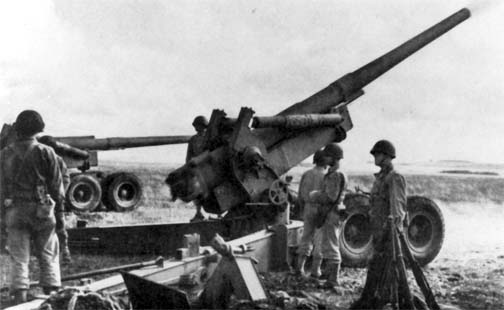 Description: 155mm Long Tom artillery units train in England during WW II. Unless otherwise noted, these photos and posters are drawn from the immense collections of the U.S. Government in the National Archives, the arch