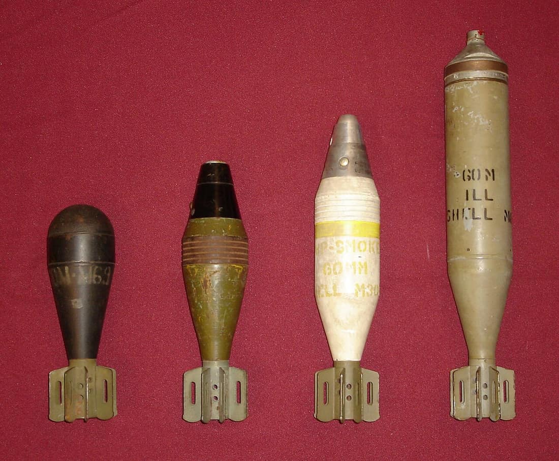 60mm mortar shells for the U.S. M2 Mortar. Left-to-Right: M69 Training/Practice, M49A2 High Explosive, M302 White Phosphorous/Smoke, M83 Illuminating (parachute flare)