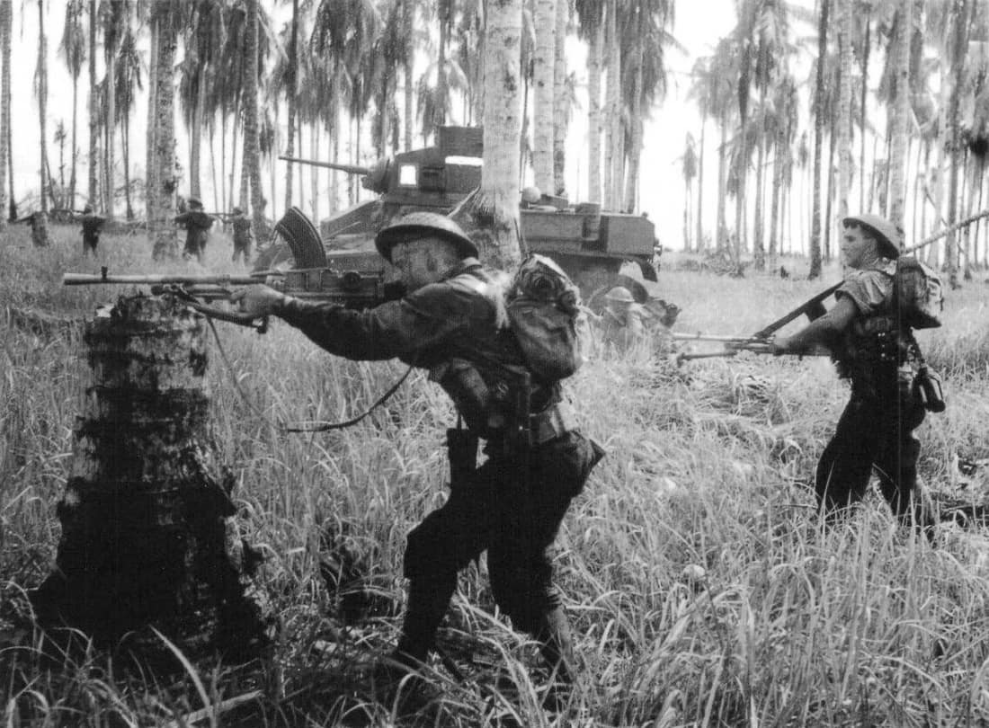 1943-01-02. PAPUA, GIROPA POINT. AUSTRALIAN MANNED M3 GENERAL STUART TANKS ATTACKING JAPANESE PILLBOXES IN THE FINAL ASSAULT ON BUNA. MEN OF D COMPANY, 2/12TH BATTALION, FIRE ON 25 JAPANESE (NOT SEEN), USING BREN MK 1 MA