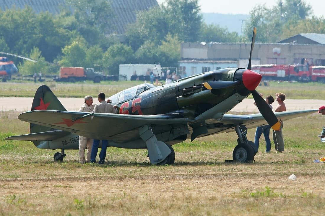 This MiG-3 was rebuilt by Aviarestorations and is 40% original. It is seen parked on the grass flightline at the Russian Air Force 100th Anniversary Airshow. Zhukovsky, Russia. 12-8-2012