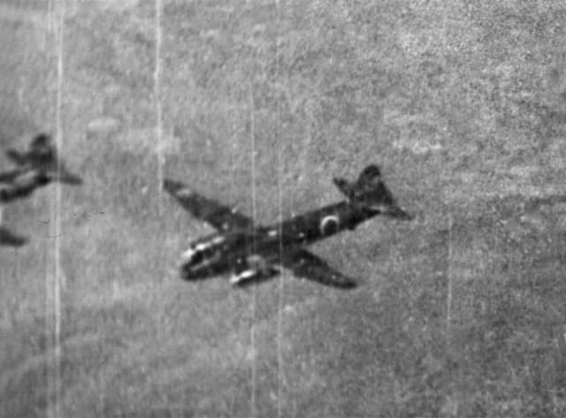 Darwin, NT. 6 June 1943. A camera gun photograph taken from a Spitfire flown by Flight Sergeant Batchelor of No. 457 Squadron RAAF, during the 58th Japanese air raid on Darwin. The aircraft in the camera gun frame is a J