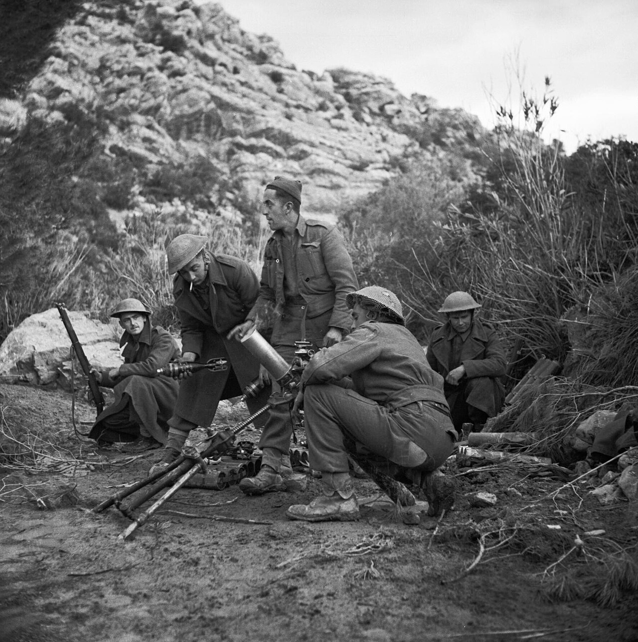 A 3-inch mortar crew from the Queens's Own Royal West Kents in action in Tunisia, 31 January 1943. A 3-inch mortar crew from the Queens's Own Royal West Kents in action, 31 Kanuary 1943.