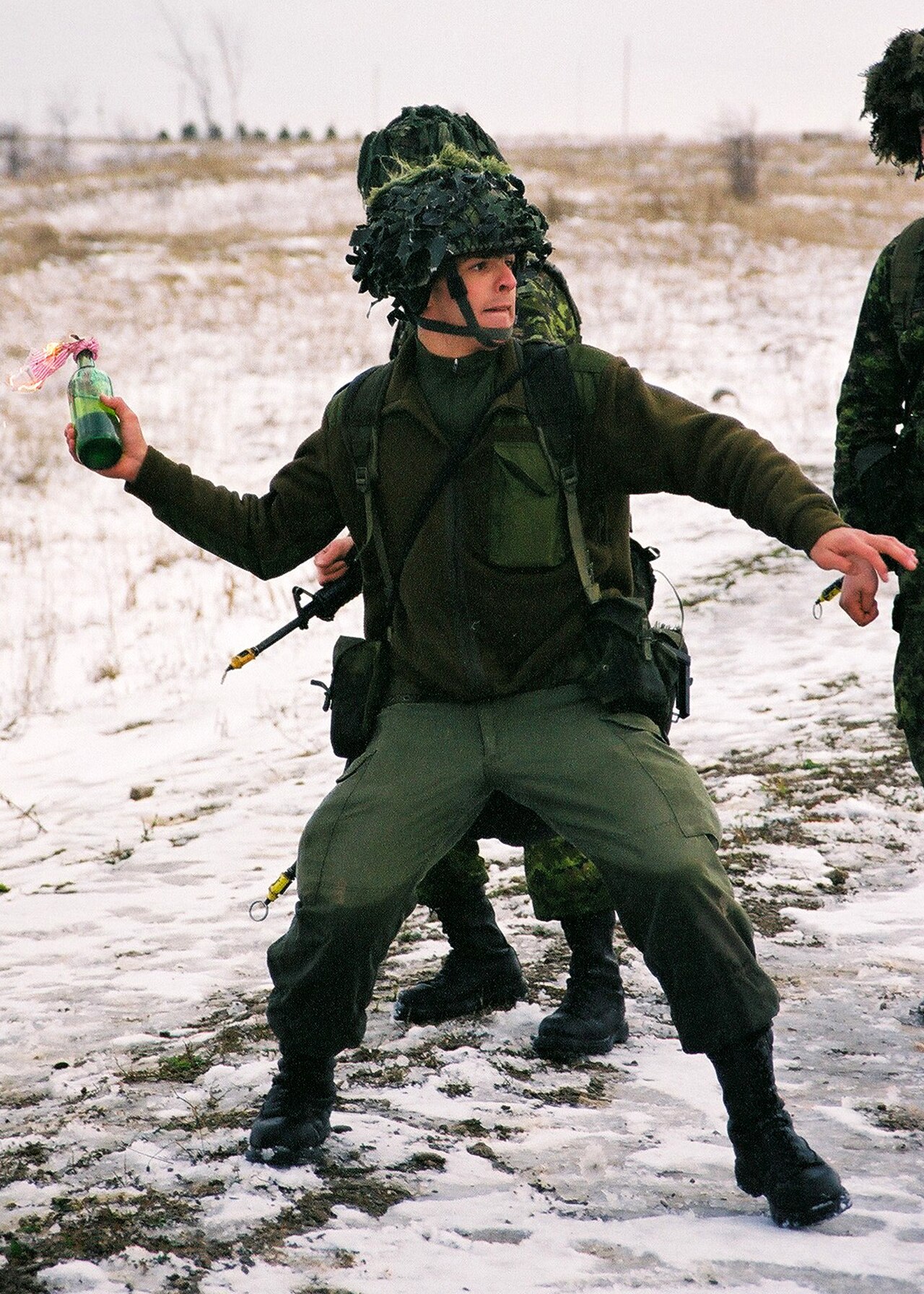 Canadian Forces soldier throwing Molotov cocktail
