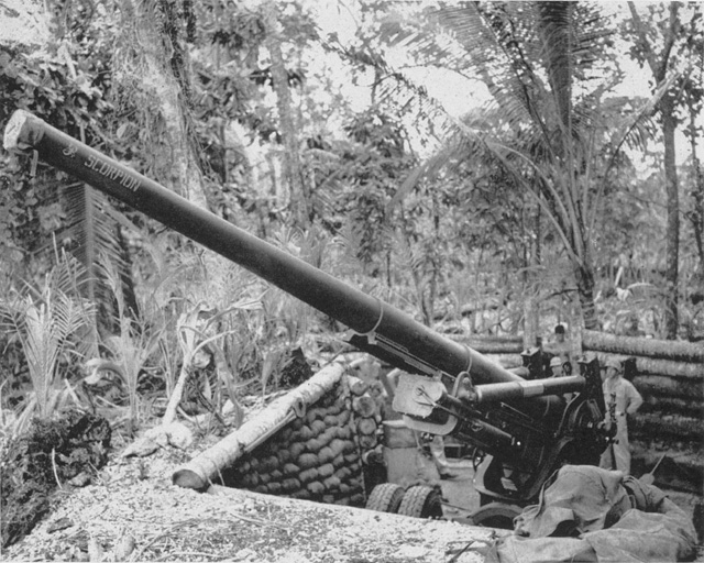 4TH DEFENSE BATTALION 155MM GUN, emplaced near Barakoma, is prepared to give General McClure's Northern Landing Force seacoast protection. The Marines' eight Long Toms never had a chance to fire at a live target, but wer
