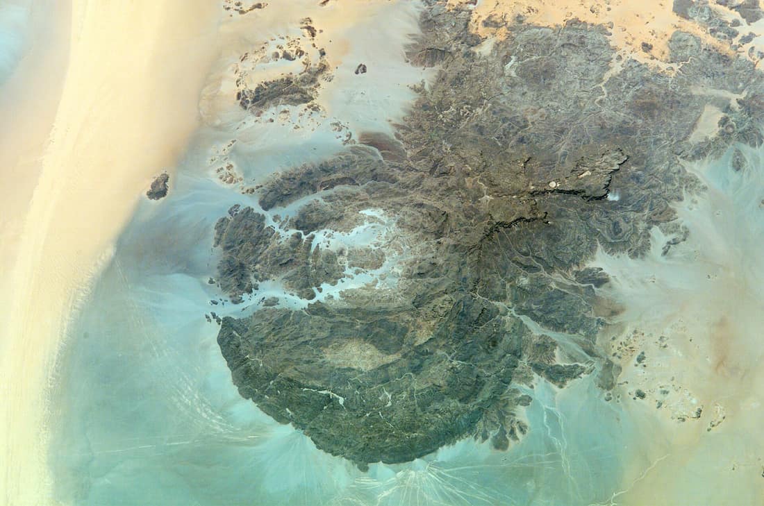 Identification Mission: ISS004 Roll: E Frame: 13542 Mission ID on the Film or image: ISS004 Country or Geographic Name: SUDAN Features: MT. UWEINAT, WIND STREAKS Center Point Latitude: 22.0 Center Point Longitude: 25.0 (