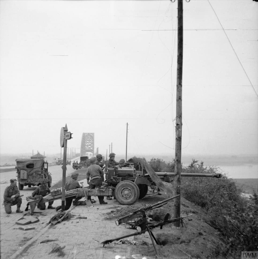 IWM caption : 17-pdr anti-tank gun of the 21st Anti-Tank Regiment, Guards Armoured Division, guards the approaches to Nijmegen Bridge.